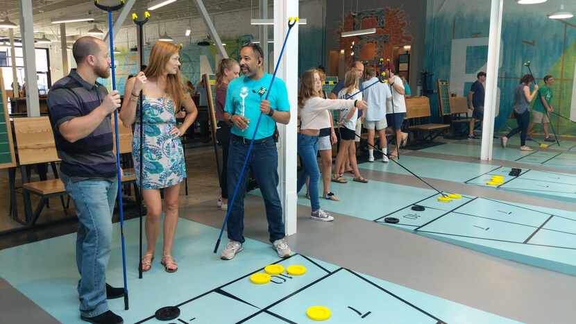 Tang & Biscuit, a huge shuffleboard club named for terms for the sport's stick and puck,...