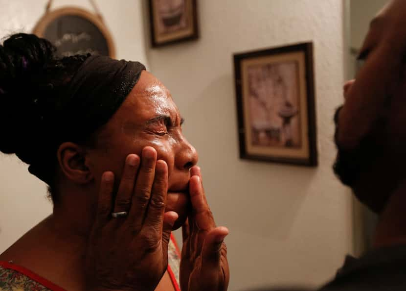 Terrence Barber washes wife Samantha's face as they prepare to leave for a worship service....