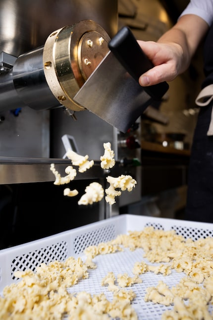 Manager Julia Atwood makes campanelle pasta at the new Lakewood Italian restaurant Due'...