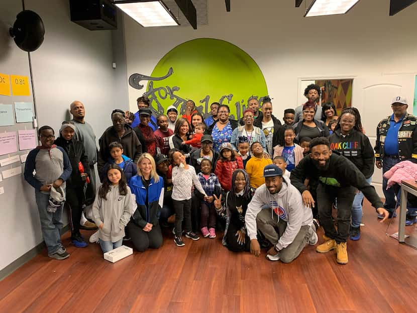 Mavericks CEO Cynthia Marshall (center, in black cap) poses with family members and...