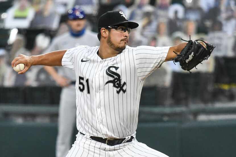 CHICAGO, IL - SEPTEMBER 26: Chicago White Sox pitcher Dane Dunning (51) delivers a pitch...