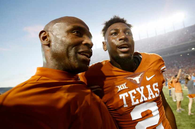 Texas head coach Charlie Strong (left) and his player Kris Boyd (2) celebrate a 35-34 win...