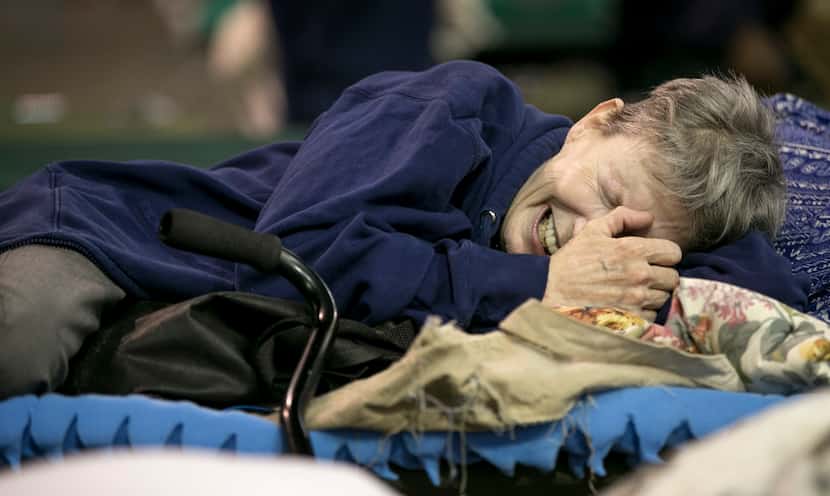 Janice Forse cries at the emergency shelter at the Beaumont Civic Center in Beaumont, Texas...