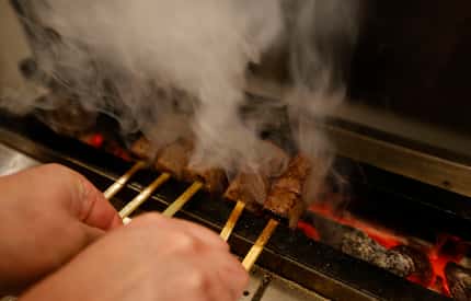 Chef Masayuki Otaka cooks Miyazaki Wagyu Beef A5 Kushiyaki at his new Japanese restaurant...