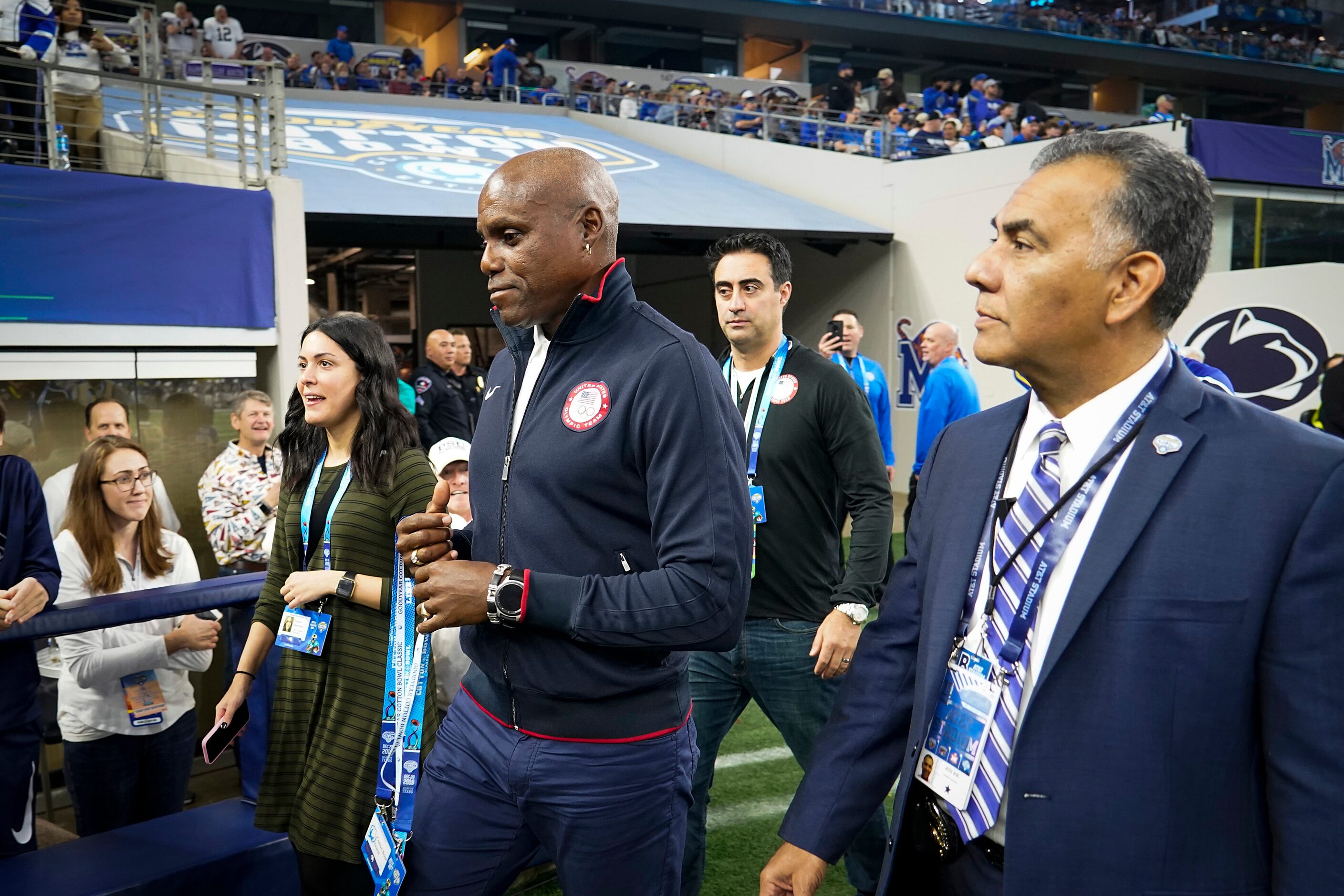 Carl Lewis visits the sidelines during the first half of the Goodyear Cotton Bowl Classic...