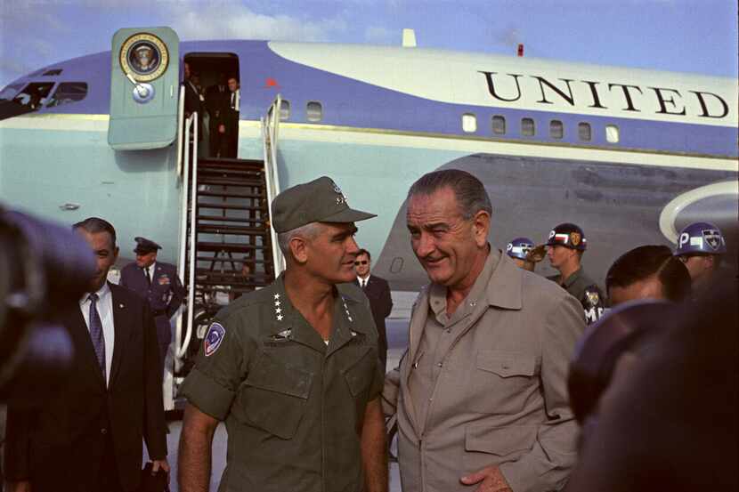  President Lyndon B. Johnson speaks with Gen. William Westmoreland during a visit to Cam...