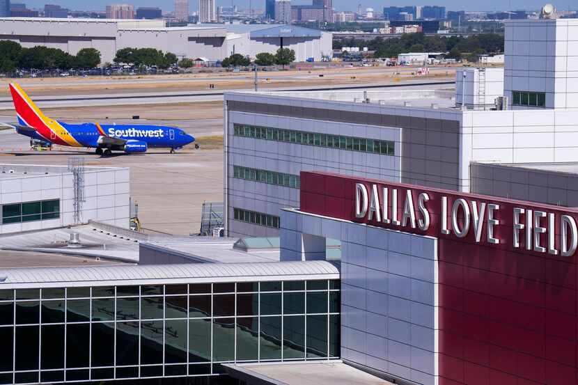 A Southwest Airlines flight taxis to the terminal at Dallas Love Field Airport.