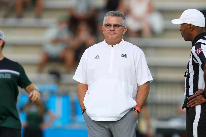 Hawaii football coach Todd Graham watches warmups before a game against Colorado State on...