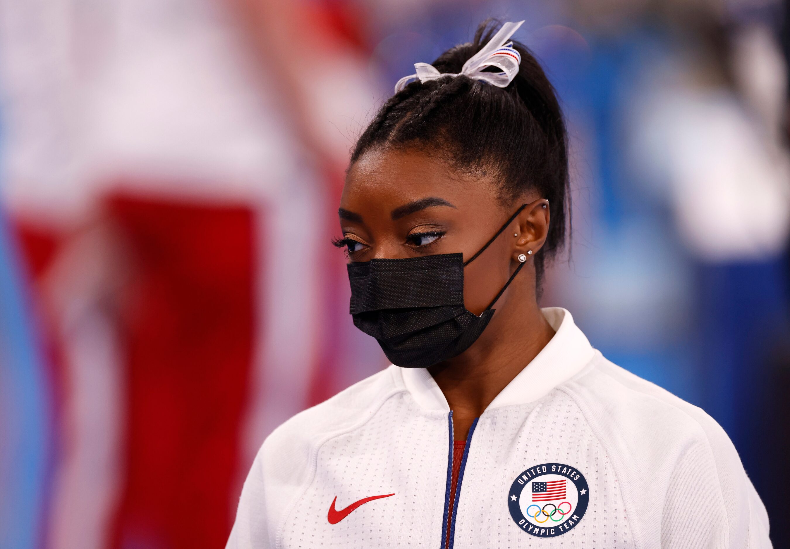 USA’s Simone Biles watches after pulling out of the competition after the vault event during...