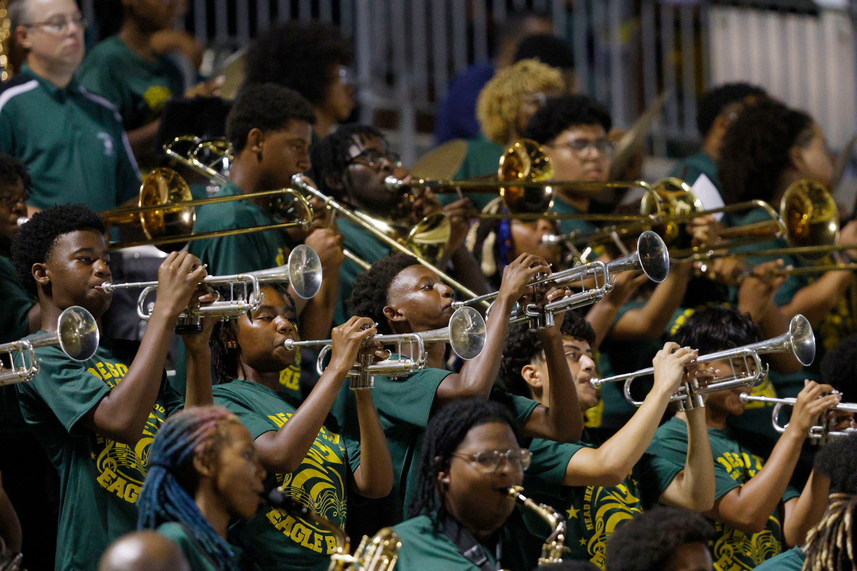 DeSoto’s marching band performs during the second half of a high school football game...