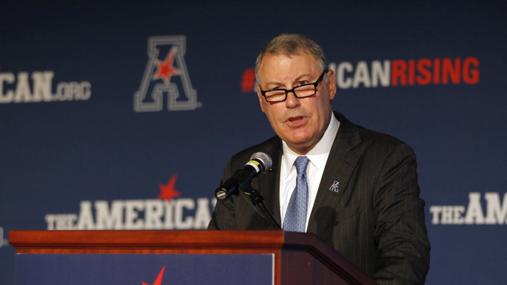 In this Aug. 4, 2015 file photo, American Athletic Conference Commissioner Mike Aresco...