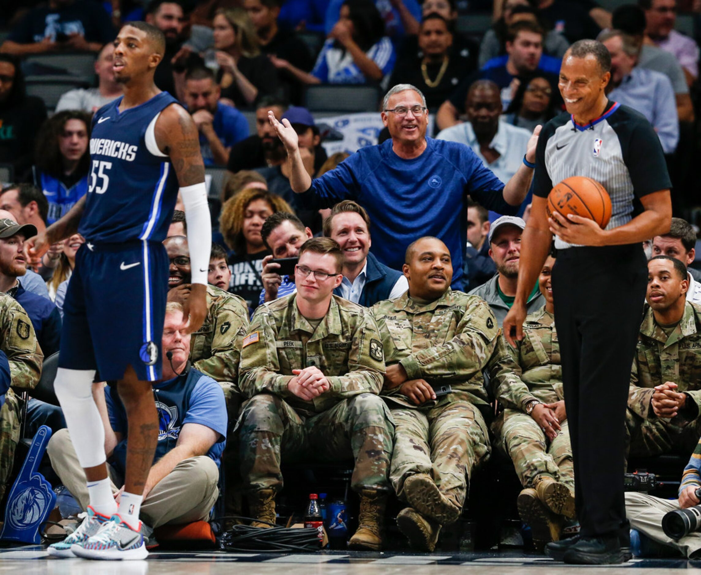 A fan argues a foul call with a referee during the third quarter of an NBA game between the...