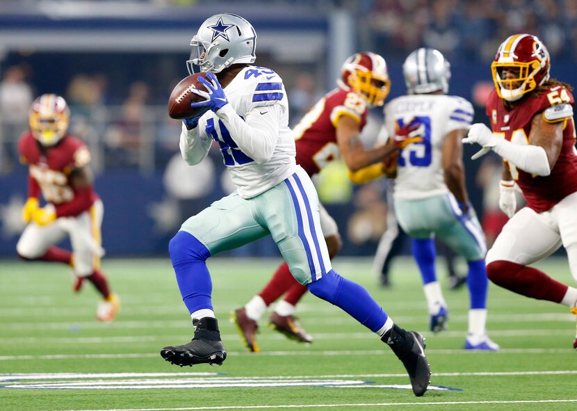 Dallas Cowboys running back Jamize Olawale (49) makes a first quarter reception and turns up...