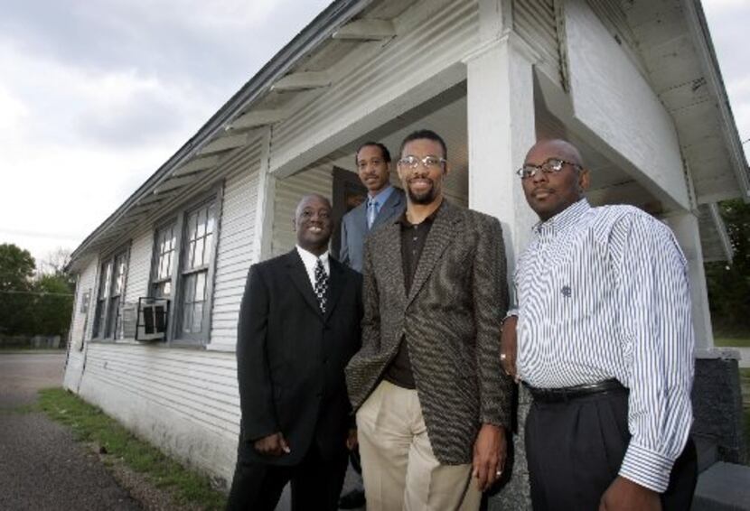 In 2005, Pastor Vincent Parker, second from right, oversaw the construction of  a new Golden...