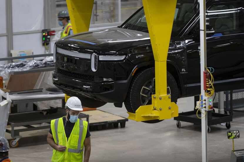 Vehicles are assembled and tested April 14, 2021, at the Rivian plant in Normal, Ill.