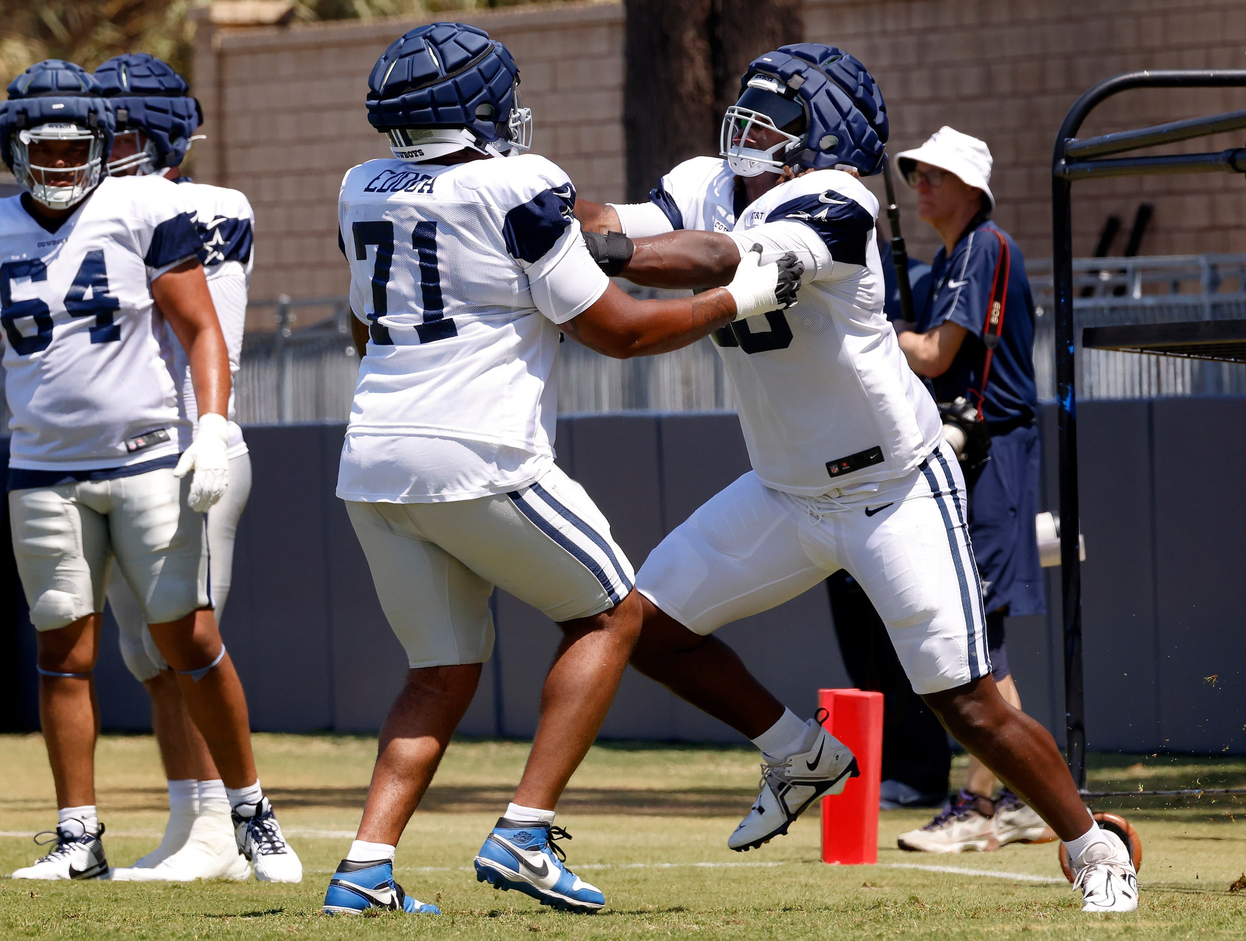 Dallas Cowboys tackle Tyler Guyton (60) blocks Dallas Cowboys guard Chuma Edoga (71) during...