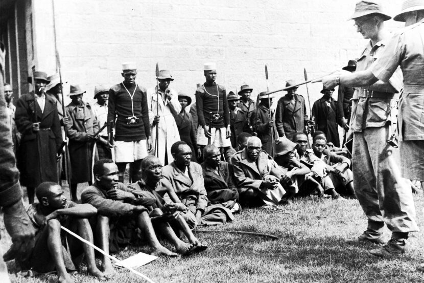 Guarded by members of the Lancashire Fusiliers, police and loyal Kikuyu spearmen, suspected...