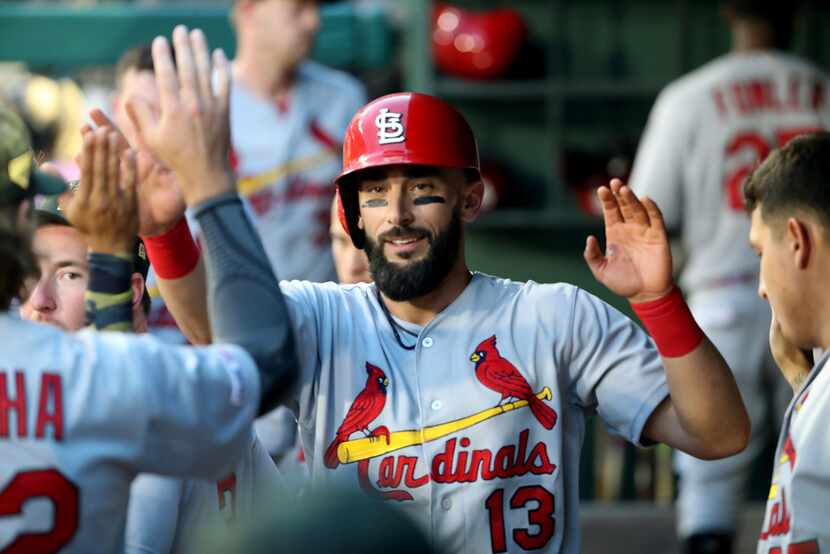 ARLINGTON, TEXAS - MAY 17:  Matt Carpenter #13 of the St. Louis Cardinals celebrates a run...