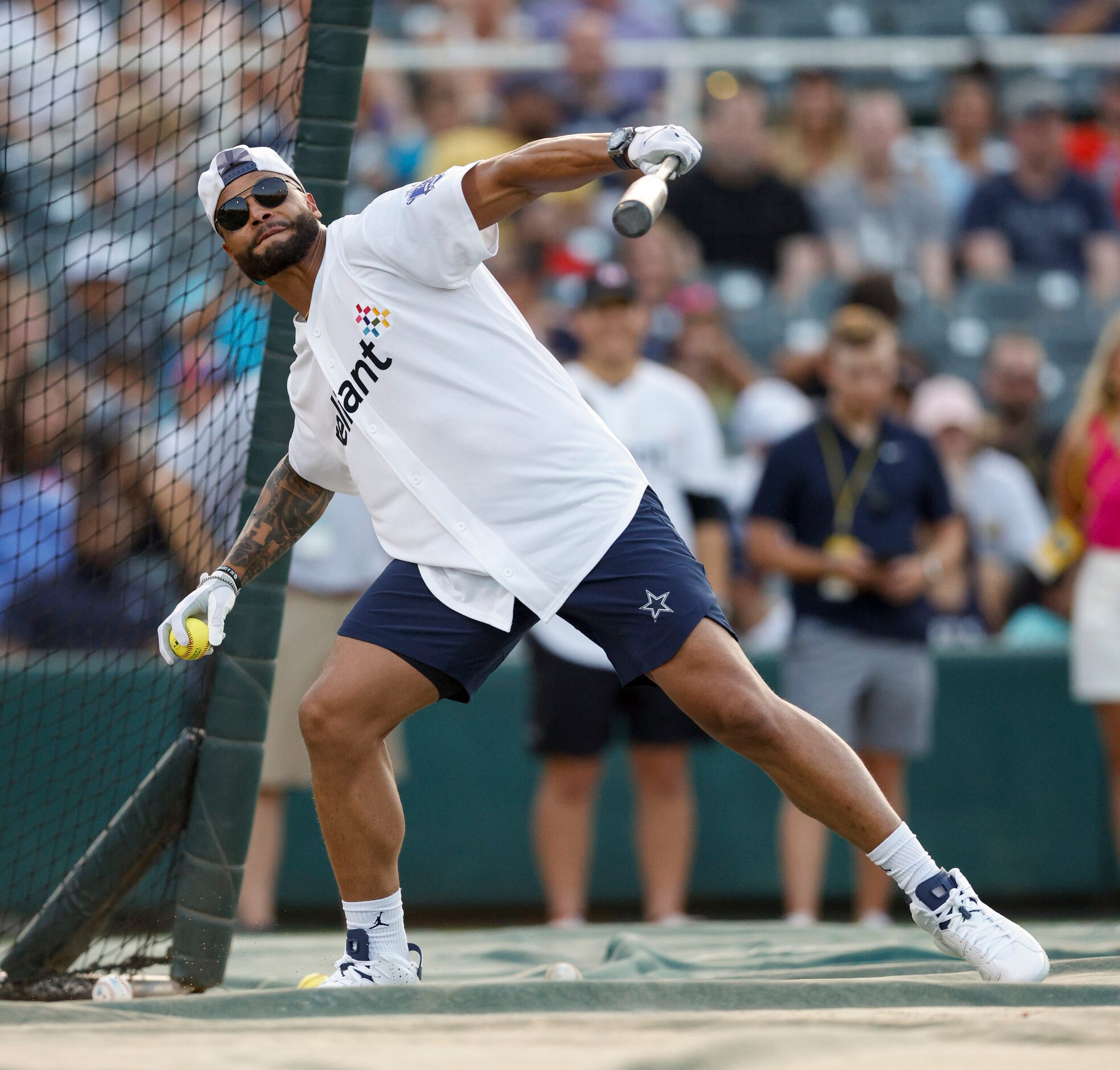 Dallas Cowboys quarterback Dak Prescott throws the ball after failing to hit a home run...