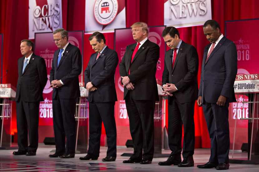  The six Republican presidential candidates who remain viable contenders observe a moment of...