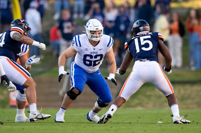 Duke offensive lineman Graham Barton (62) blocks Virginia defensive end Chico Bennett Jr....