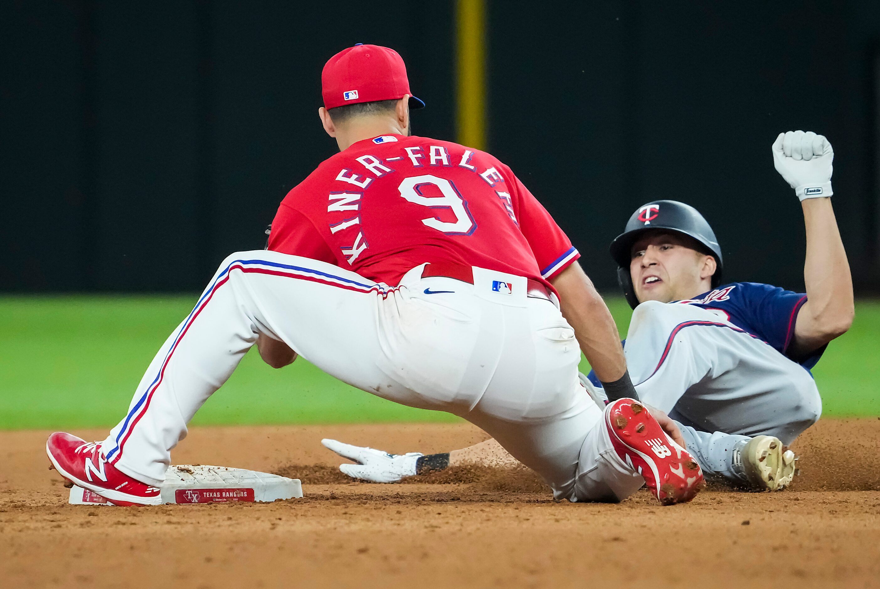 Minnesota Twins first baseman Alex Kirilloff is out at second base as Texas Rangers...