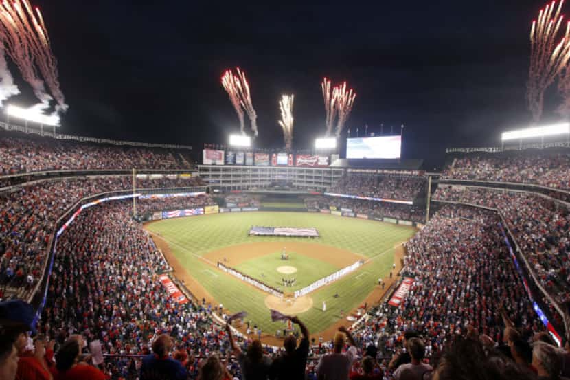 Fans cheer at the start of the Texas Rangers-Baltimore Orioles American League Wildcard...