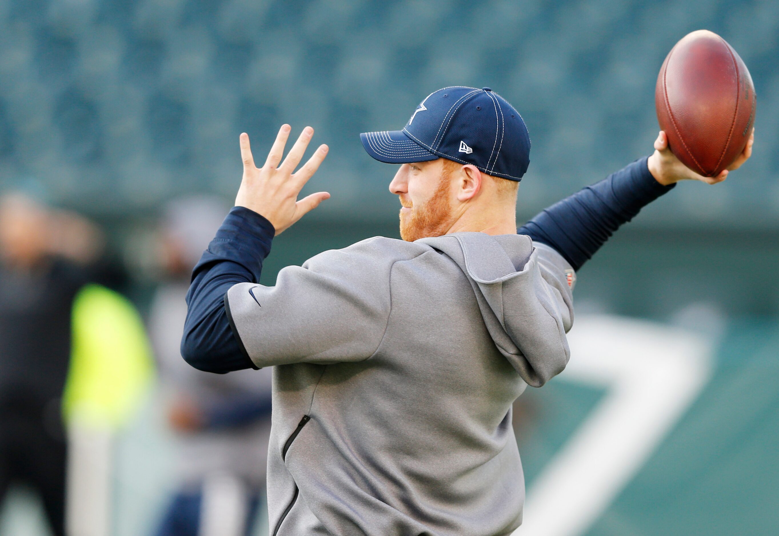 Dallas Cowboys quarterback Cooper Rush (7) throws the ball before warmups prior to a game...