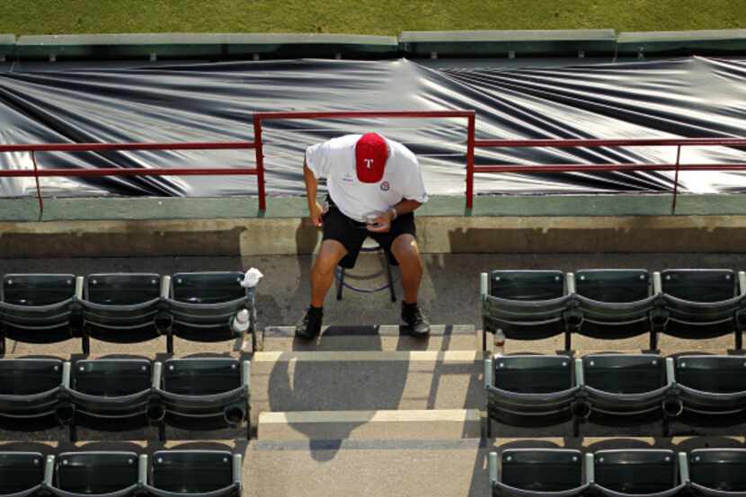 A Rangers event staff employee was stationed in the aisle at Rangers Ballpark on Friday.