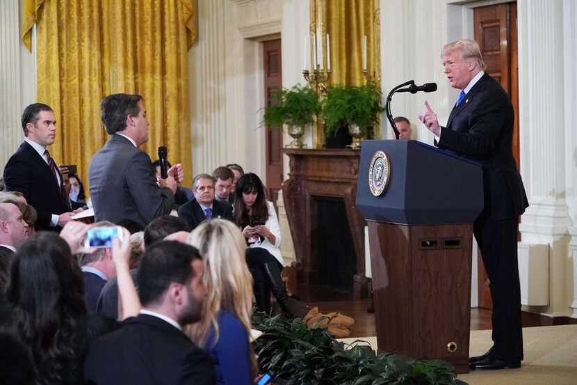 President Donald Trump (R) gets into a heated exchange with CNN chief White House...