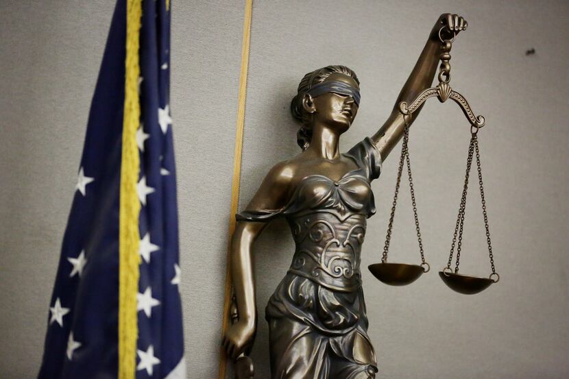 Lady Justice in a courtroom in the Frank Crowley Courts Building in Dallas