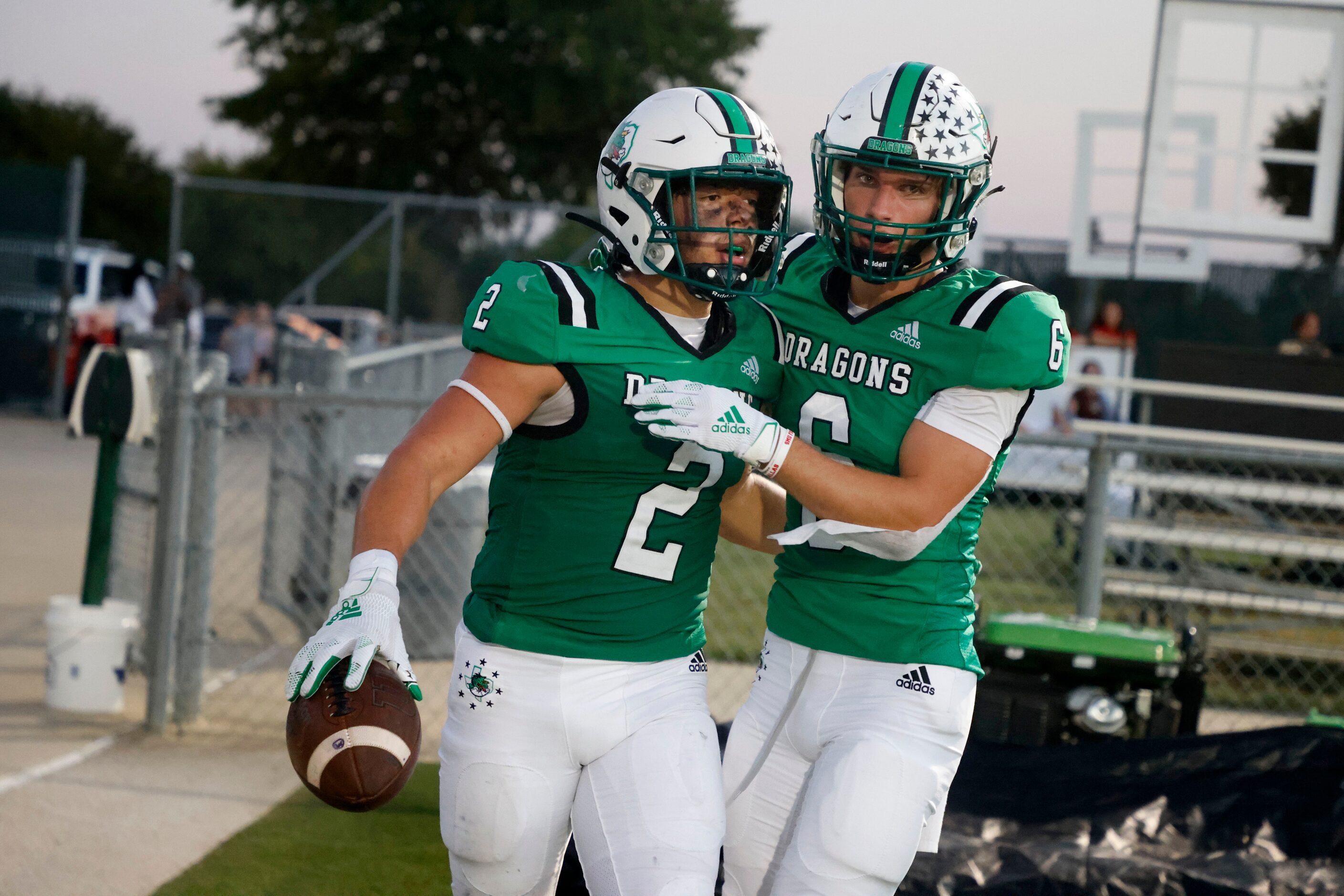 Southlake Carroll running back Owen Allen (2) celebrates his rushing touchdown with Landon...