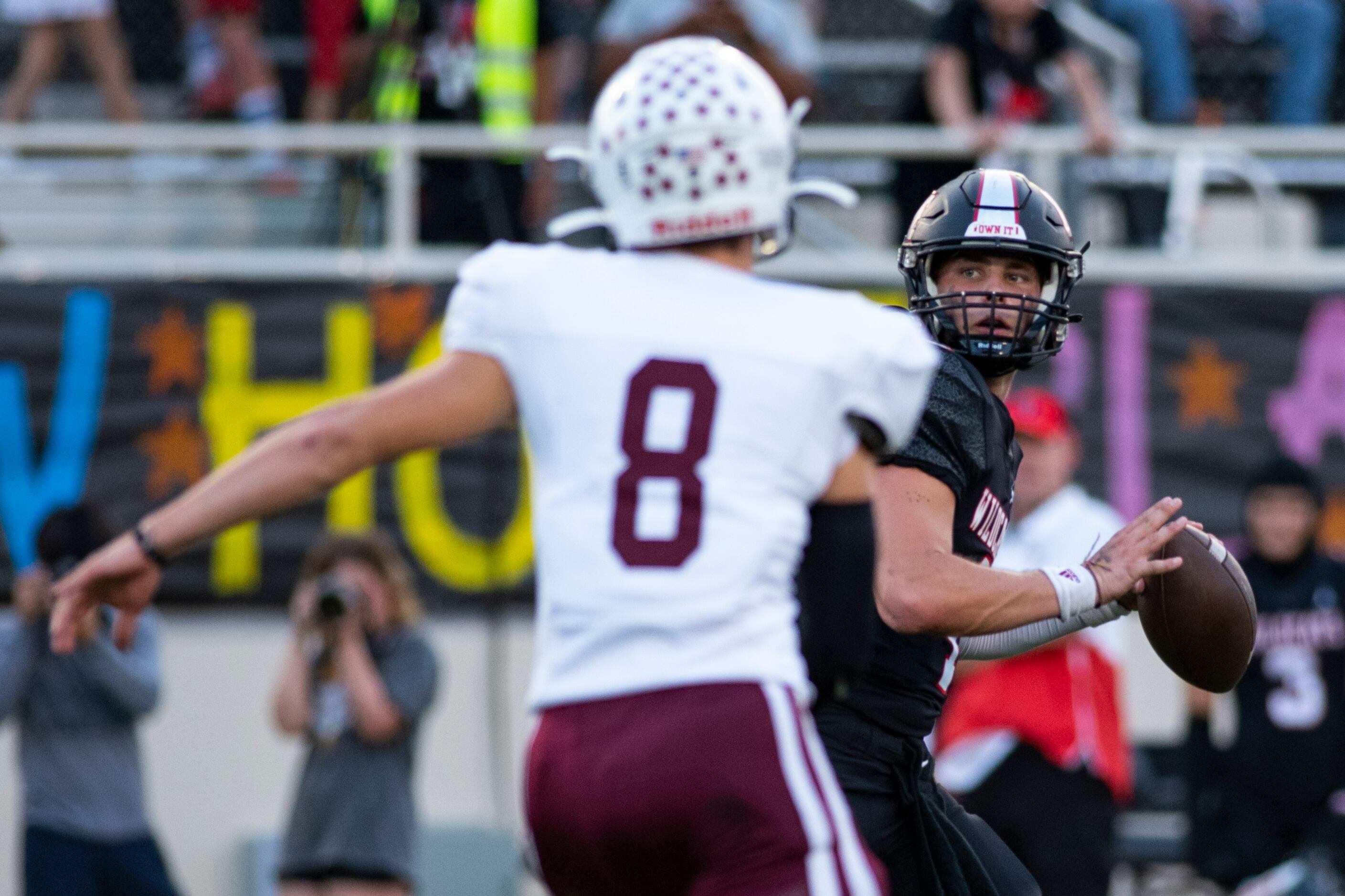 Lake Highlands senior Caden Dotson (4) peers at a receiver down the field during Lake...