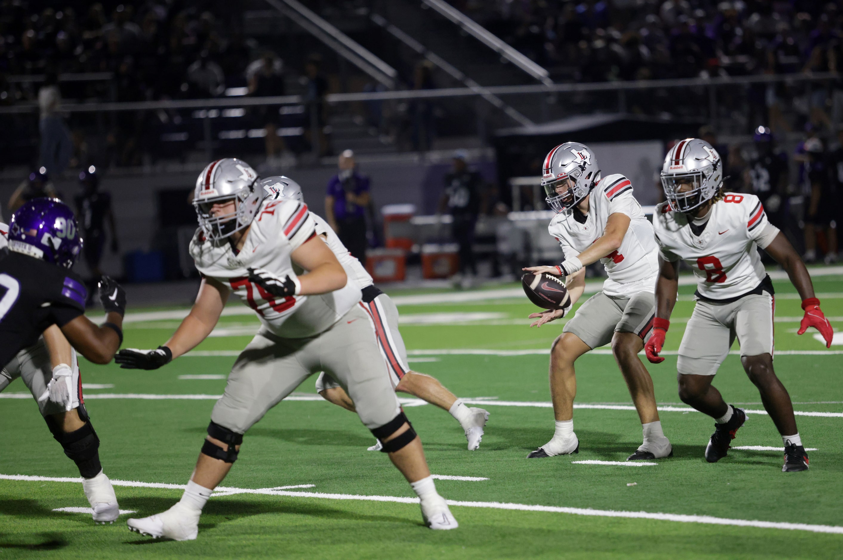 Lovejoy player #4 Jacob Janecek receives the snap during the Lovejoy High School at Anna...