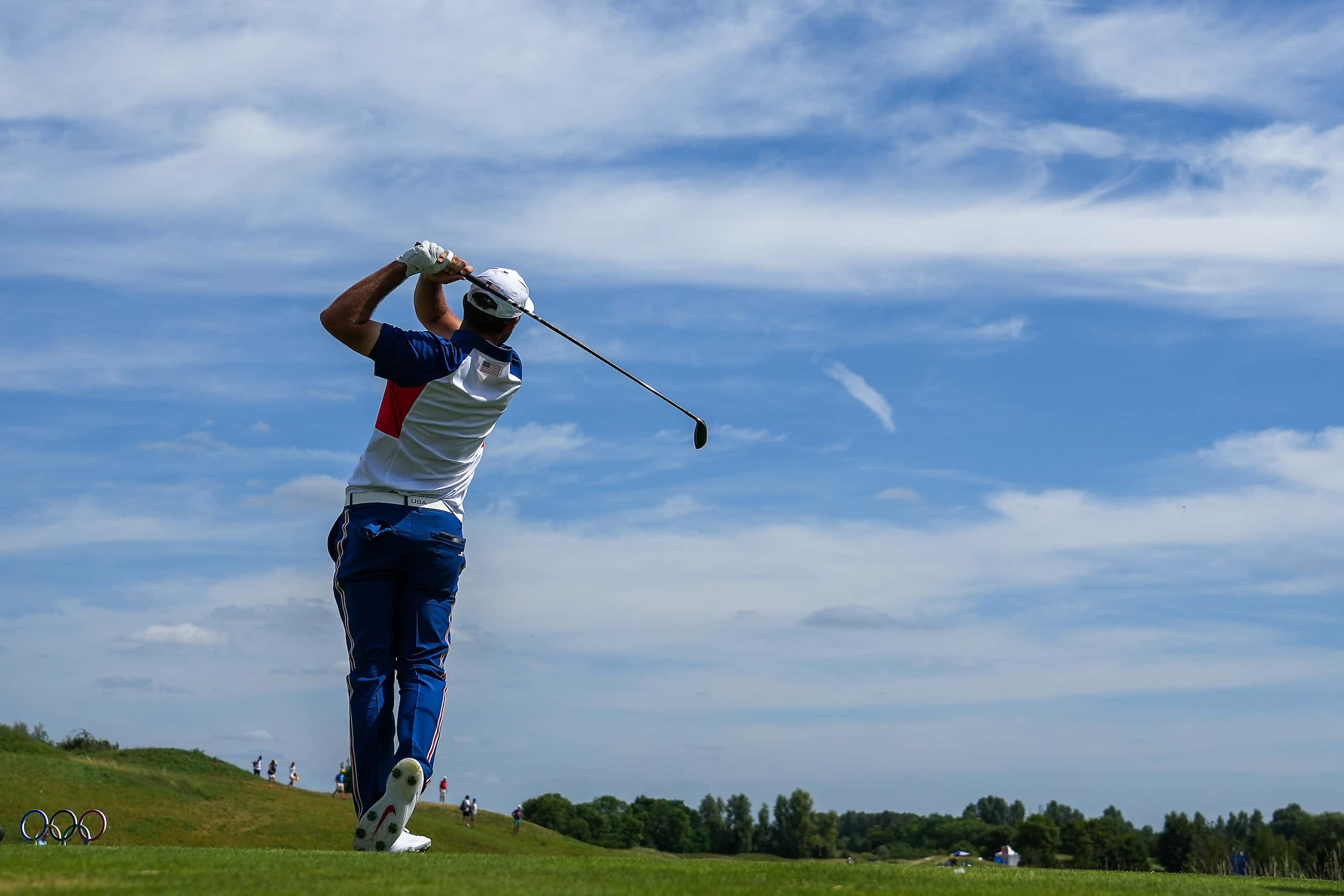 Scottie Scheffler of the United States hits from the 13th tee during the final round of...