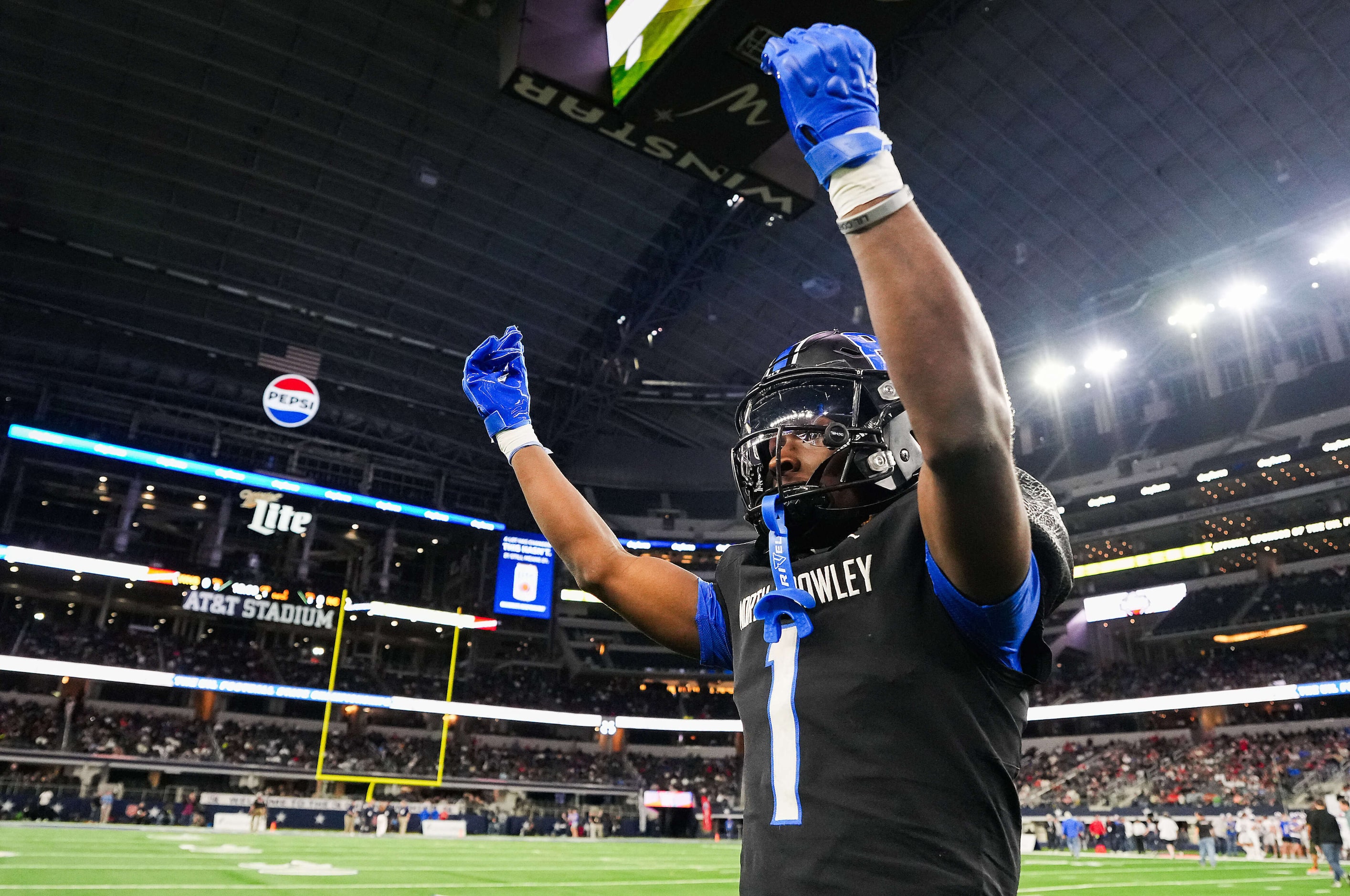 North Crowley running back Cornelius Warren III tries to fire up the crowd before the Class...