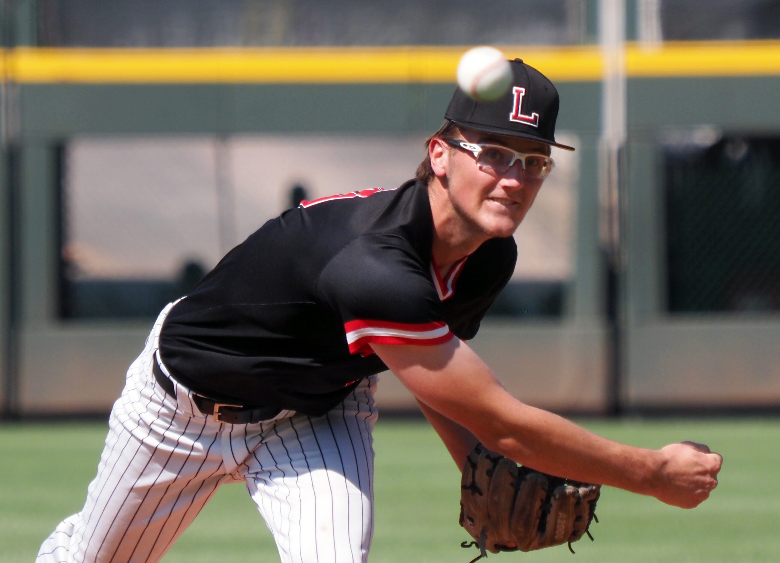 Mansfield Legacy pitcher Blake Julius pitches against Friendswood in the UIL baseball 5A...