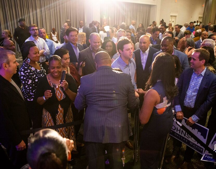 Mayor-Elect Eric Johnson takes picture with supporters after giving remarks during his...