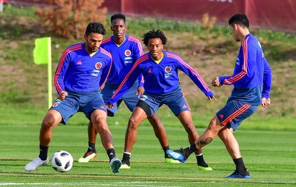 (L to R) Colombia's midfielder Abel Aguilar, Colombia's defender Yerry Mina, Colombia's...