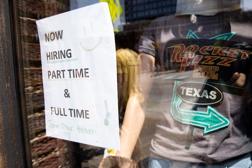 A hiring sign outside Rocket Fizz in Deep Ellum