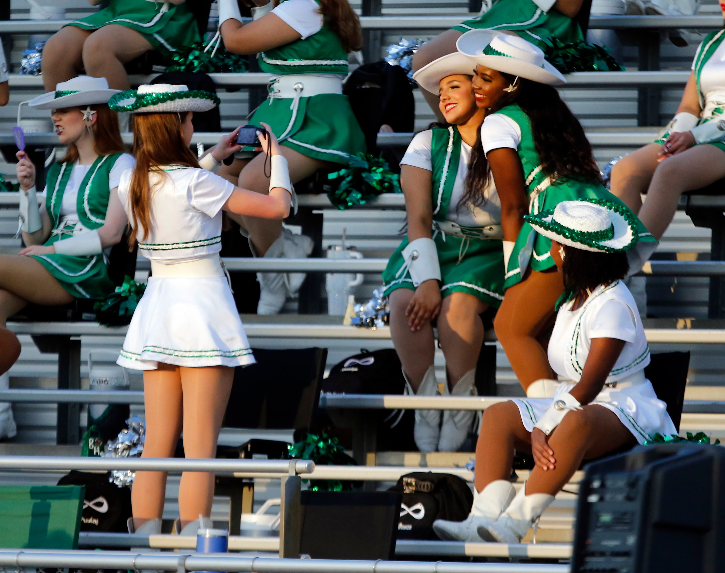 Richardson Berkner High drill team members take a Kodak moment during the first half of a...