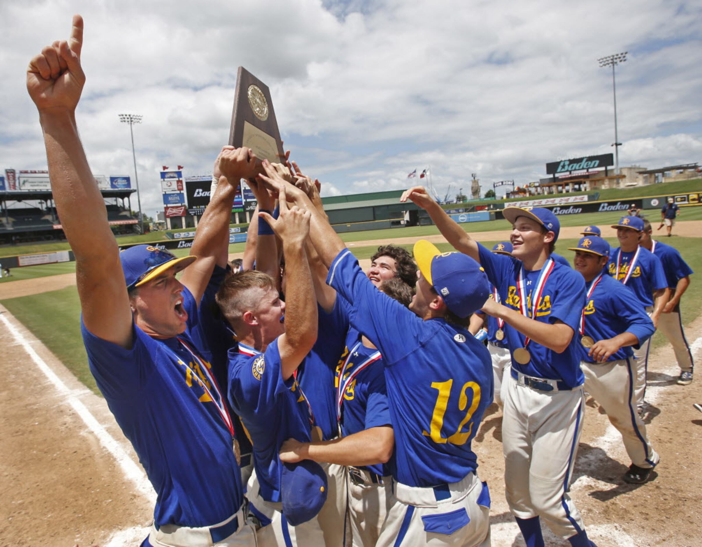 Sunnyvale's Ryan Cottingame, left, and teammates celebrate their 13-3 championship game win...