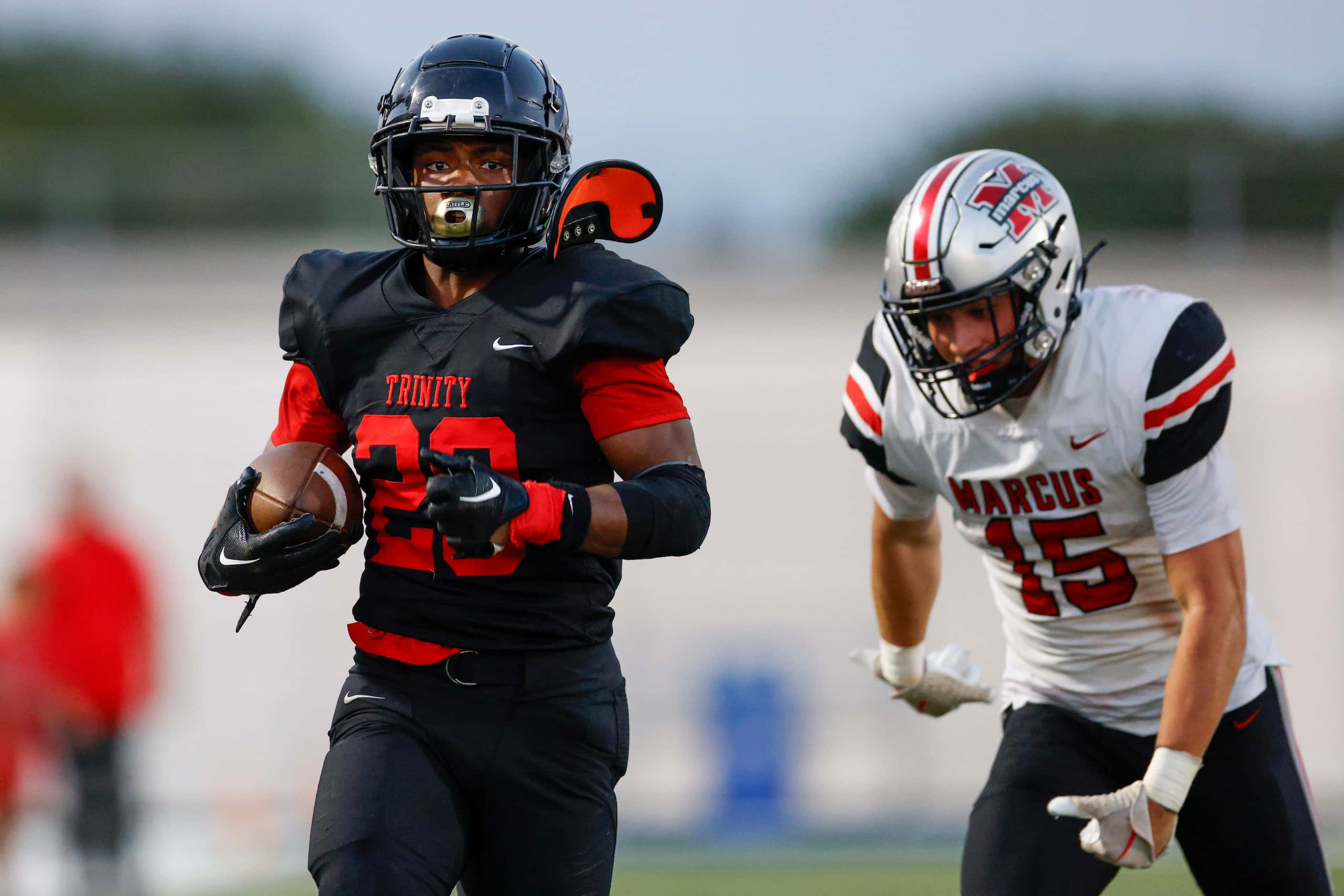 Euless Trinity running back Josh Bell (20) scores a touchdown ahead of Flower Mound Marcus’...