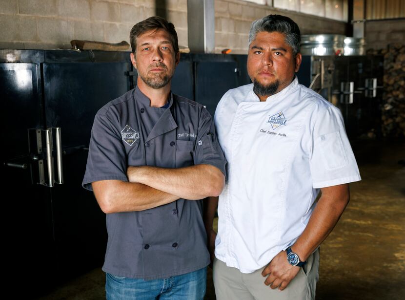 Tim McLaughlin (left) stands with Damian Avila in the smoker room at Crossbuck BBQ in...