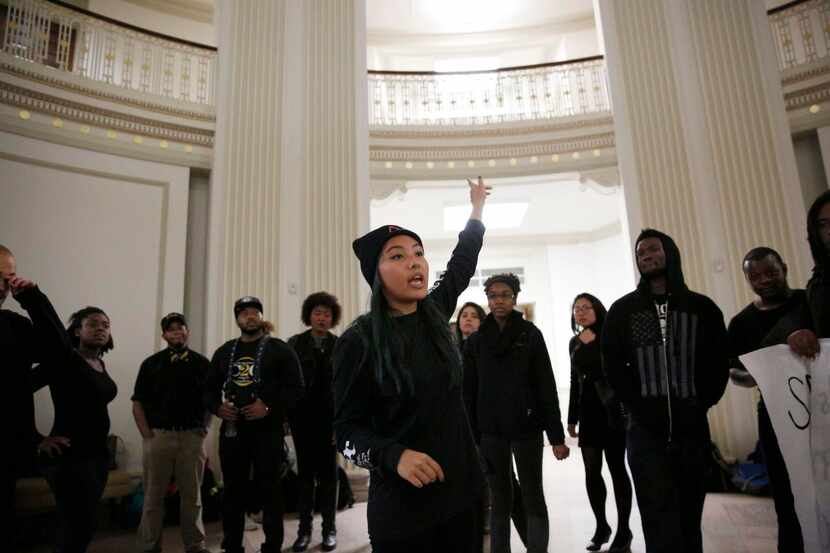 Tien Dang organized  SMU students gathered in Dallas Hall’s rotunda Monday for a group photo...
