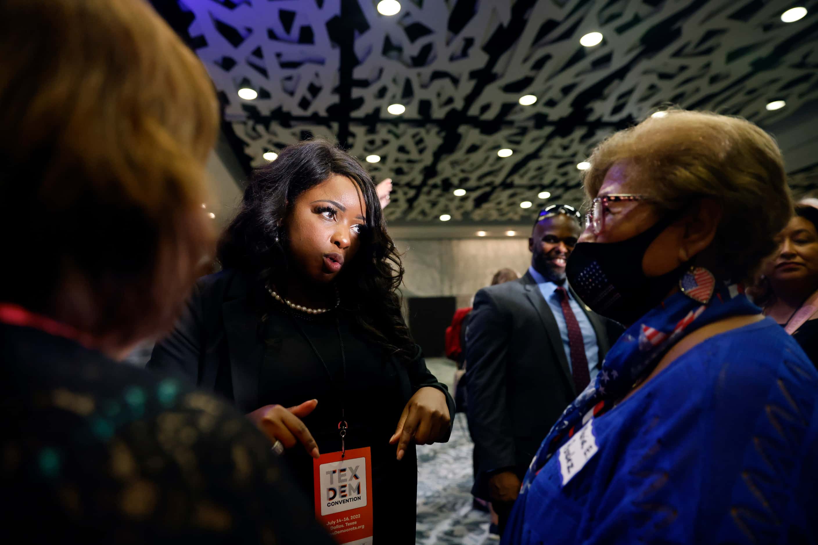 U.S. House Texas District 30 candidate Jasmine Crockett (center) visited with delegates and...