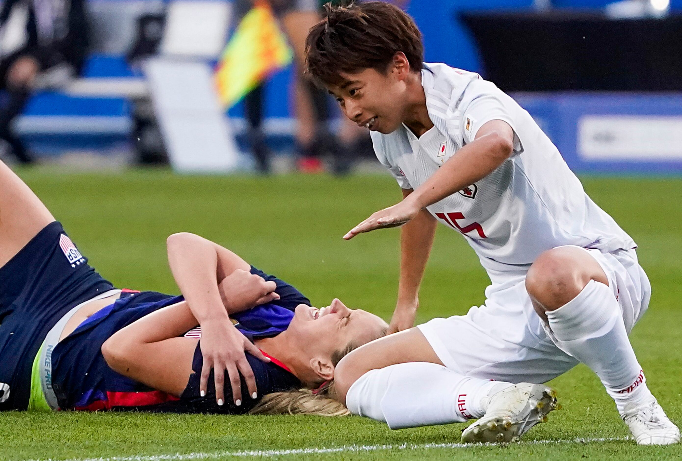 Japan forward Mina Tanaka (15) collides with USA midfielder Lindsey Horan (9) for a penalty...