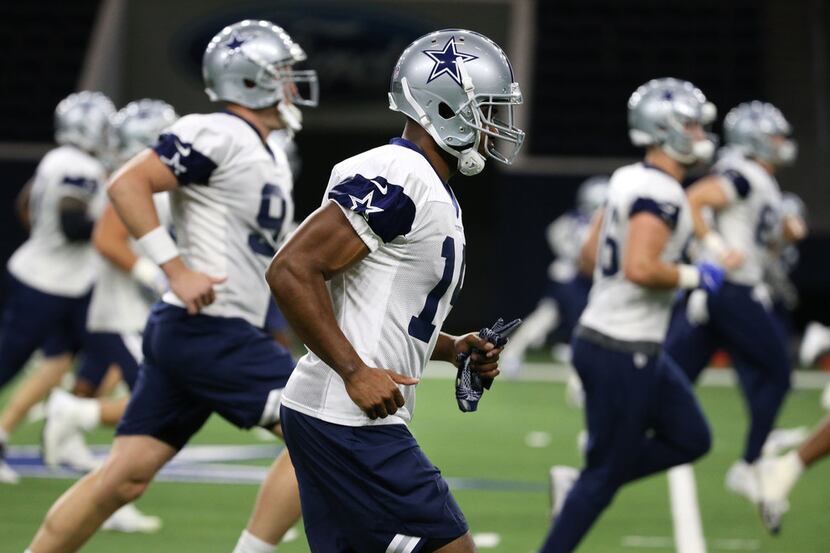 Dallas Cowboys receiver Amari Cooper (19) warms up during Dallas Cowboys practice at The...
