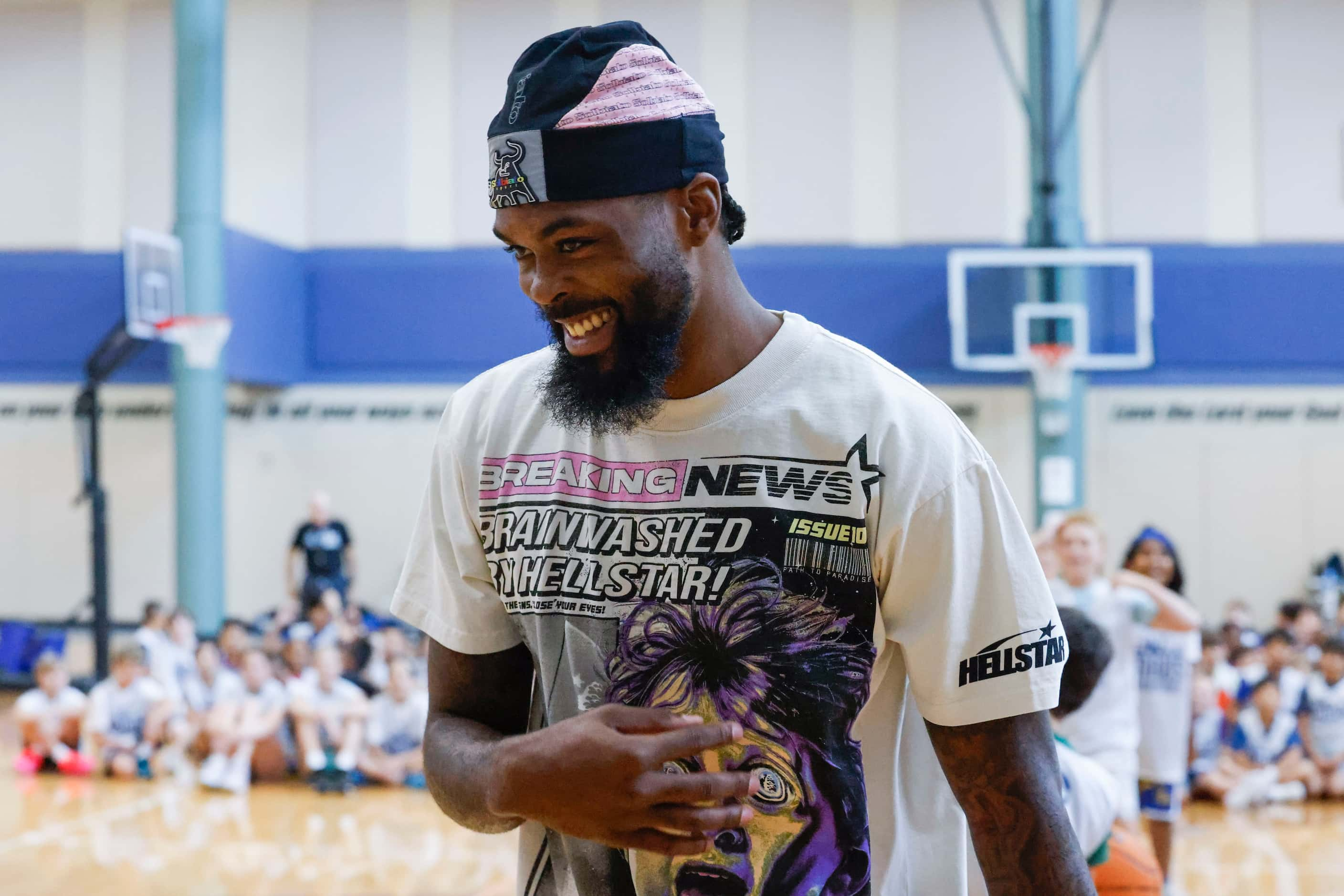 Dallas Mavericks’ Naji Marshall, reacts after missing to score against young basketball...