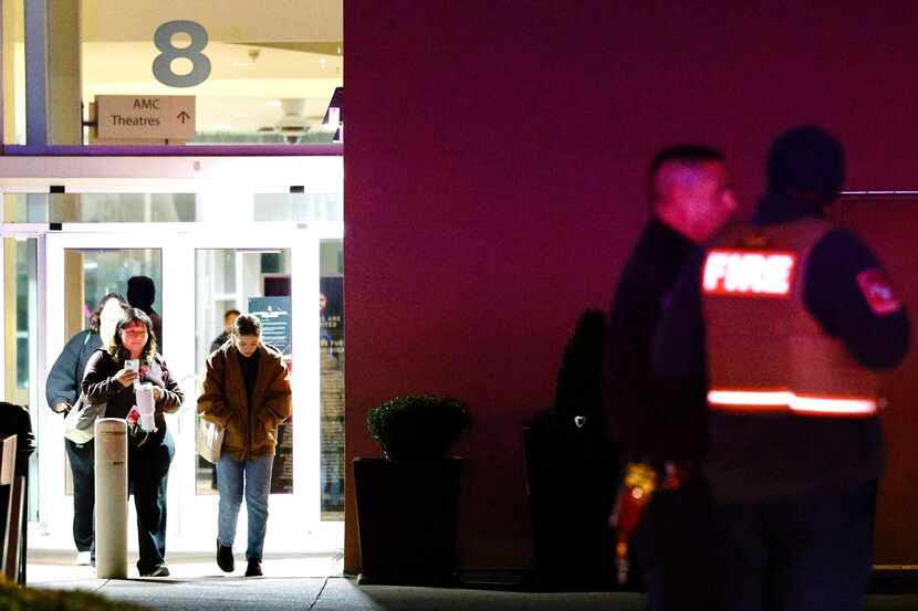 People leave as Arlington police and fire-rescue responded to a shooting Dec. 28, 2023 at...